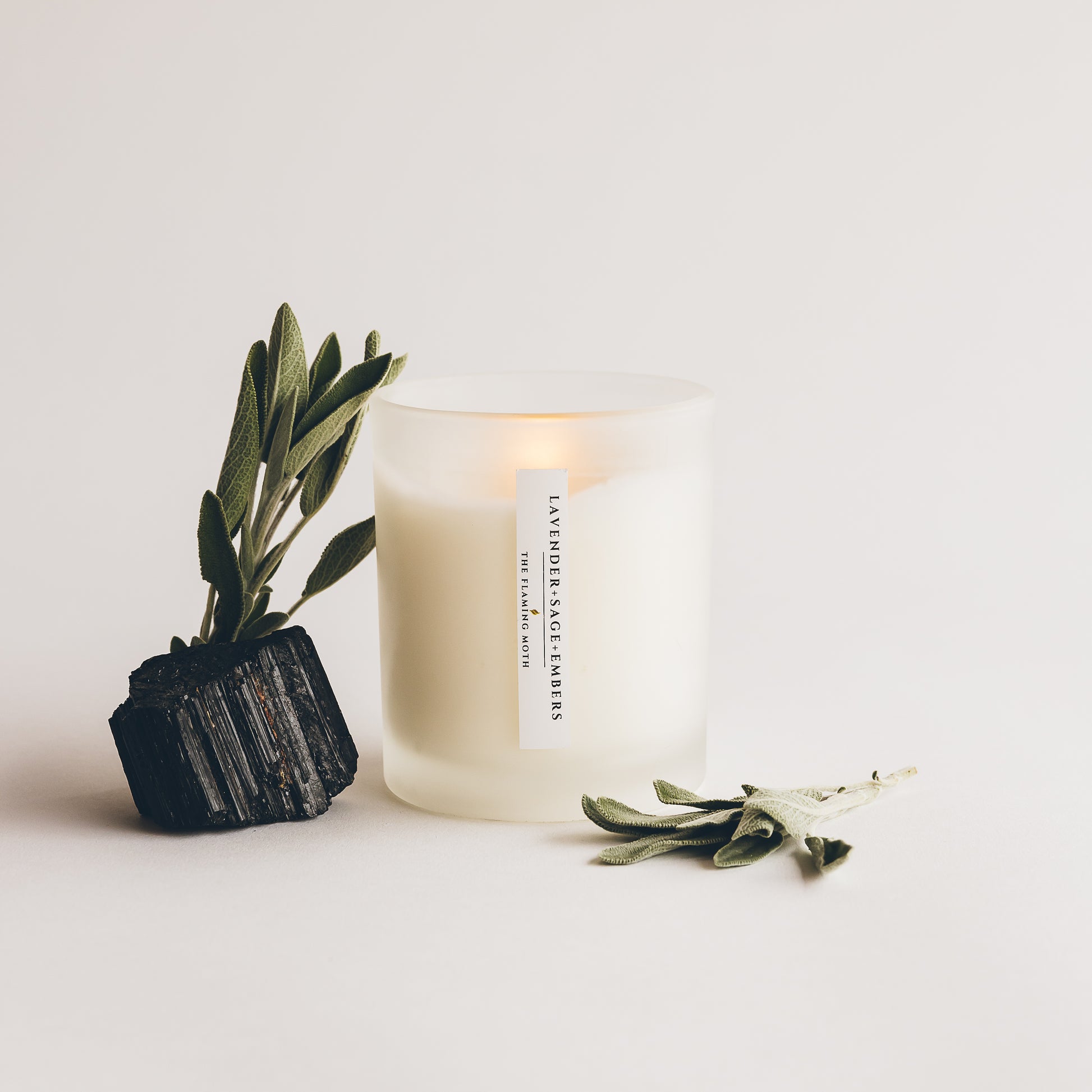 lavender sage embers candle with sage leaves and charcoal stone
