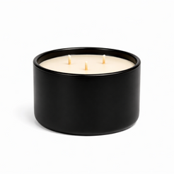 three wick candle in black ceramic vessel